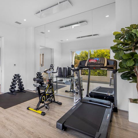 Jump out of bed and straight into a morning workout in the master suite's private gym
