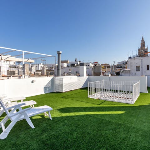 Take in the views of La Giralda from the shared roof terrace