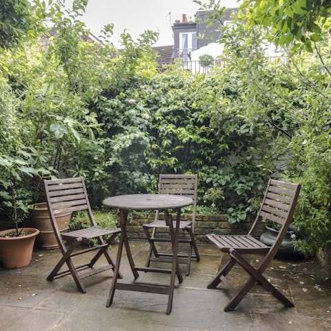 Indulge in an aperitif on the plant-filled patio