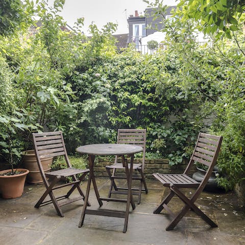 Indulge in an aperitif on the plant-filled patio