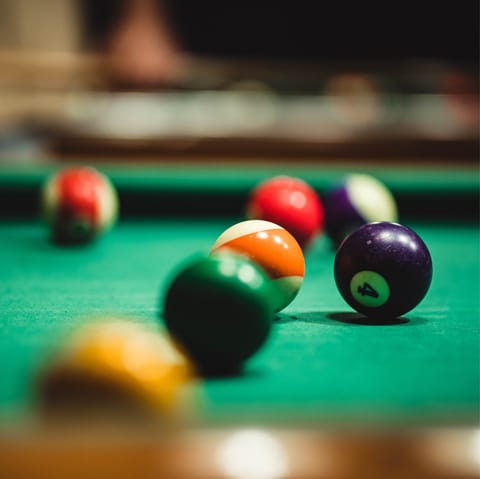 Unwind with a friendly game of billiards in the recreation room