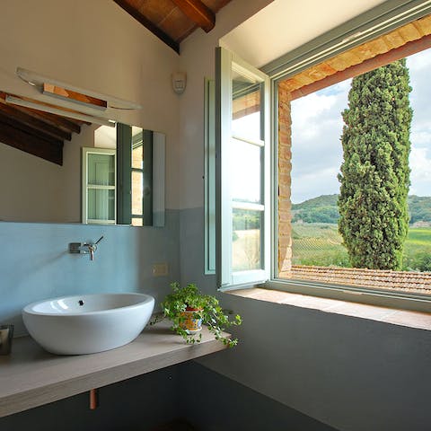 Freshen up in bathrooms with typical Tuscan views