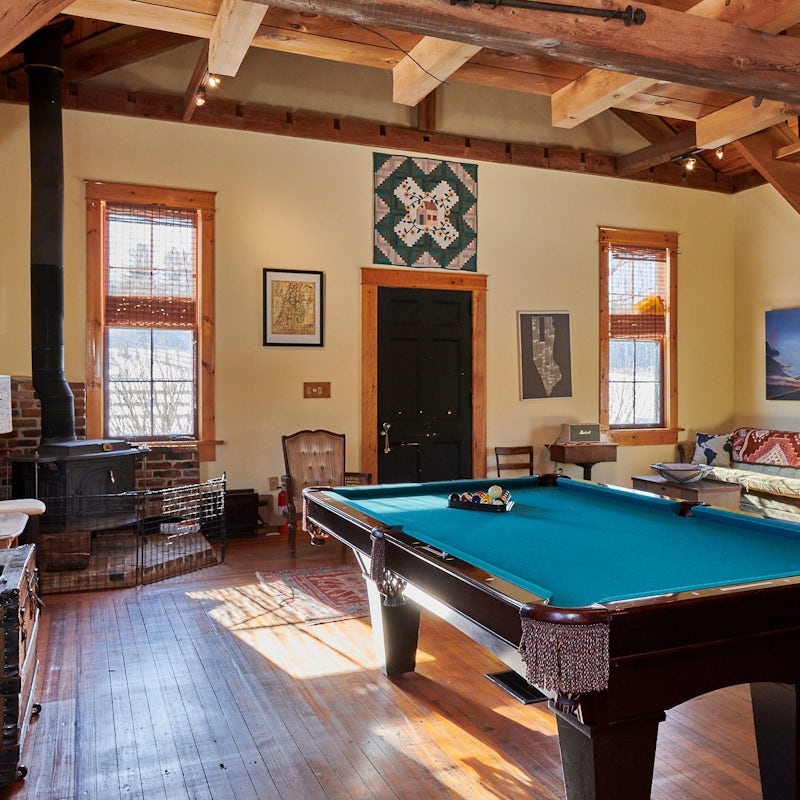 Play billiards while the wood burns and the fire crackles