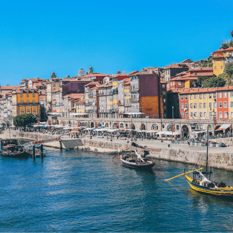 Soak up the colourful atmosphere of waterfront Cais da Ribeira, thirty-five minutes away by Metro