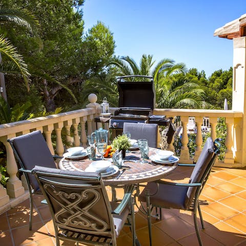 Dine alfresco on the terrace while watching the palm trees sway