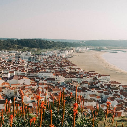 Spend sunny afternoons on Praia de Faro, a short drive or ferry away 