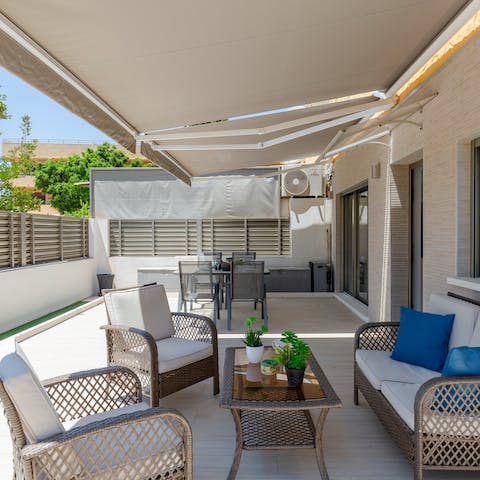 Enjoy a sundowner in the shade on your private patio