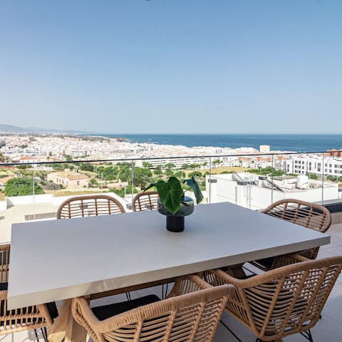 Pour a glass of your favourite wine and dine alfresco on your balcony with scenic coastline views