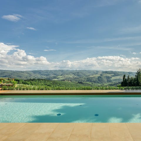 Swim laps in the shared swimming pool overlooking the Tuscan hills