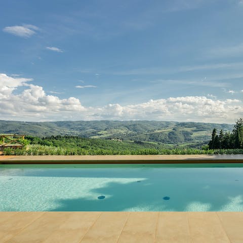 Swim laps in the shared swimming pool overlooking the Tuscan hills
