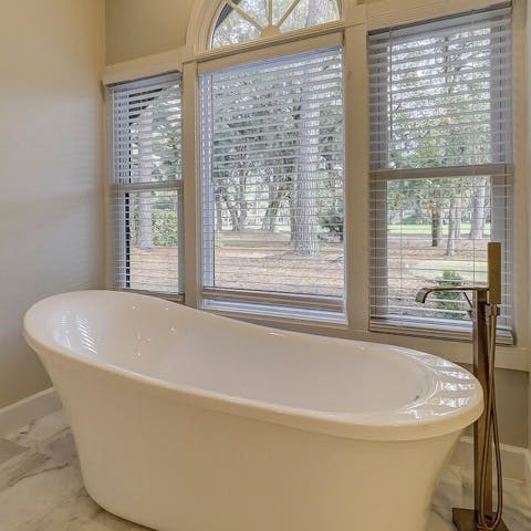 Soak your troubles away in this freestanding bathtub with peaceful views