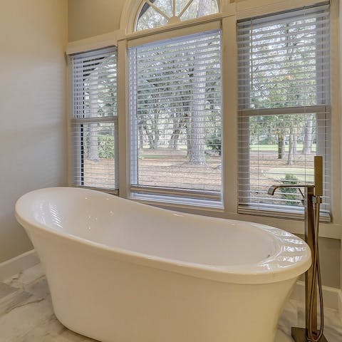 Soak your troubles away in this freestanding bathtub with peaceful views