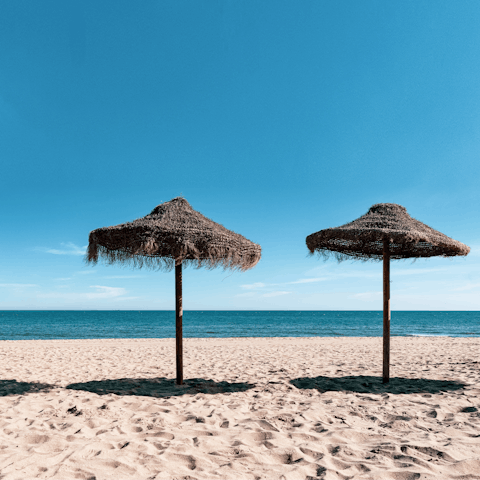 Sprawl out on Fuengirola's sandy beach, just 50m away