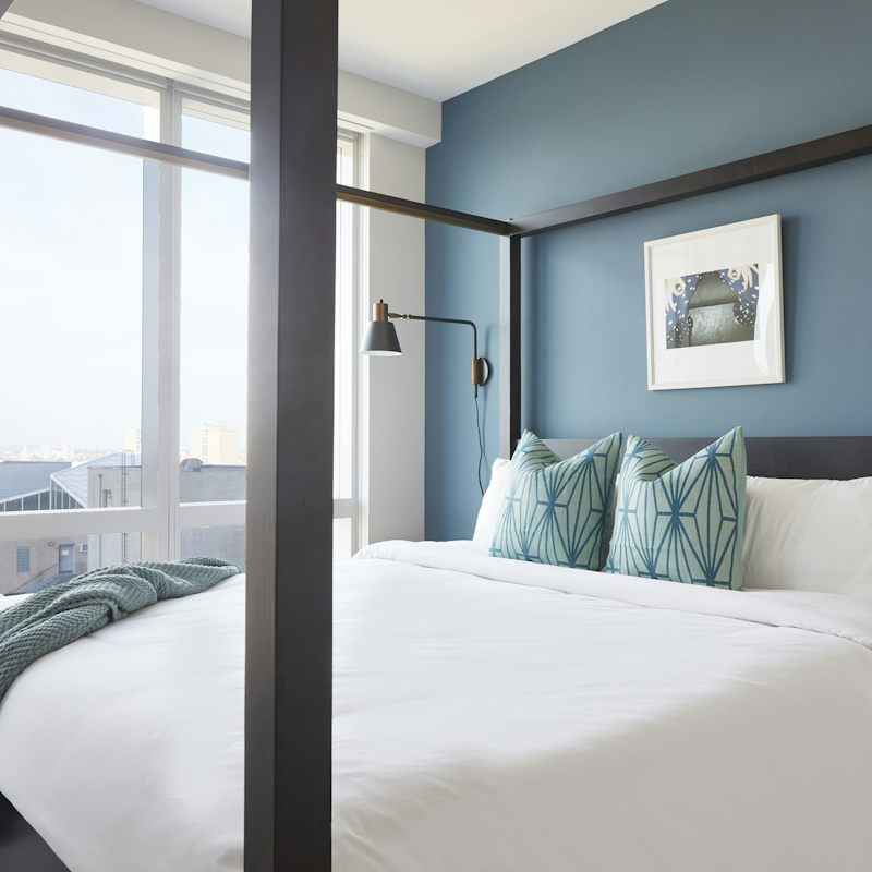 Fall asleep in the modern four-poster bed for a fabulous night's sleep