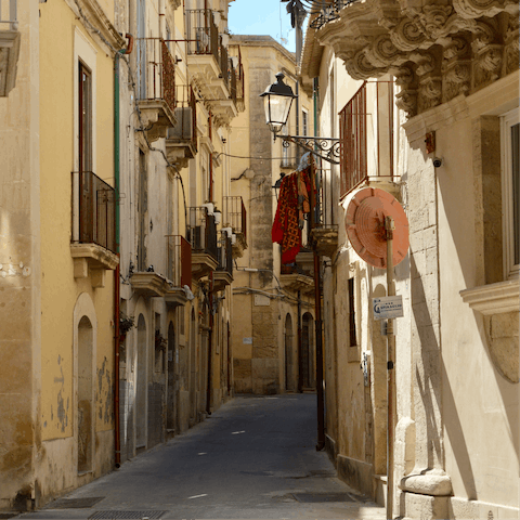 Spend a day strolling through the charming streets of Catania, a 20km drive away 