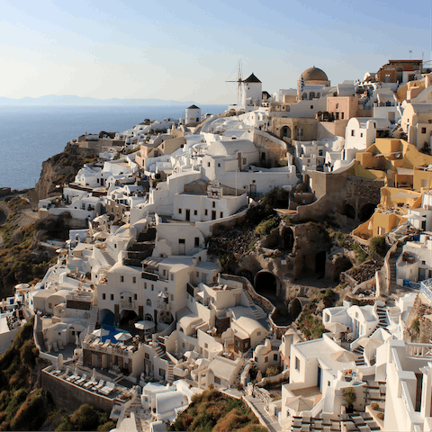 Explore the wonders of Santorini, starting with the beautiful town of Oia