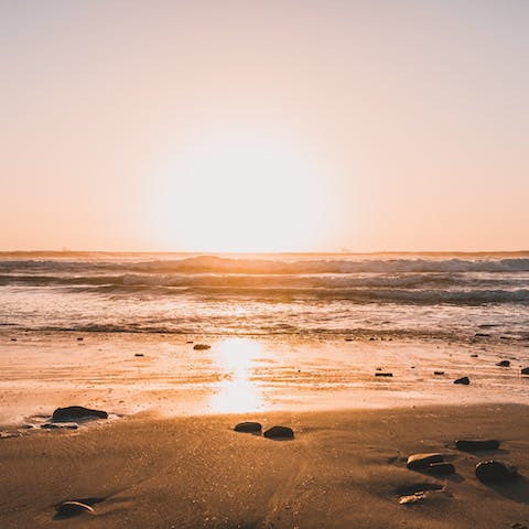 Sink your toes in the sand at beautiful Sunset Beach and Queen's Beach
