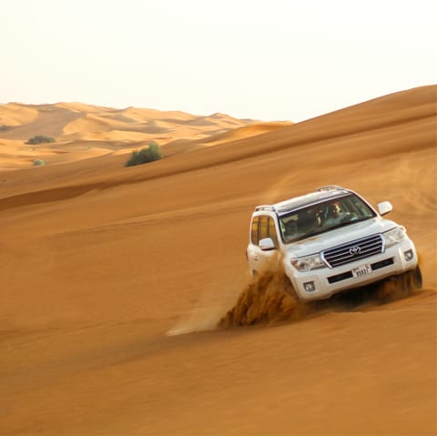 Head for the red sands with a dune cruise in a 4X4 