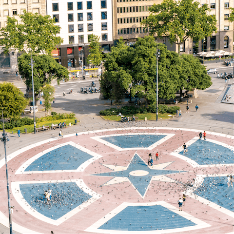 Explore vibrant Plaça de Catalunya nearby