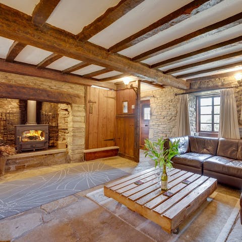 Curl up beside the original inglenook fireplace of this 19th-century cottage