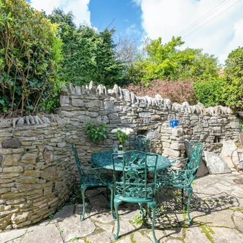 Soak up the sunshine and views of the Purbeck Hills from the courtyard garden