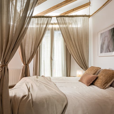 Fall asleep in the dreamy four-poster bed