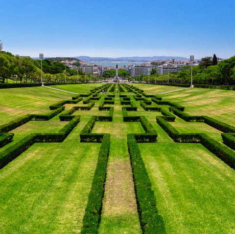 Stroll through the green beauty of nearby  Parque Eduardo VII