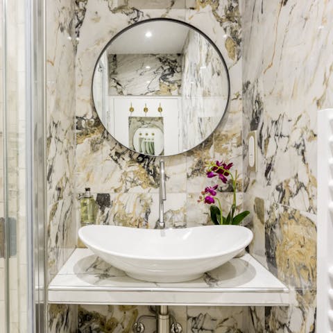 Get ready in the marble-clad bathroom before an evening at one of the locale's stylish restaurants