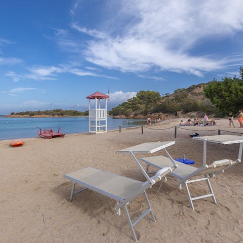 Spend an afternoon relaxing on Pizzichina Corallina Beach, a seven-minute stroll from your home