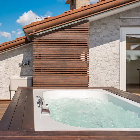 Step outside and embrace the natural elements from the hot tub