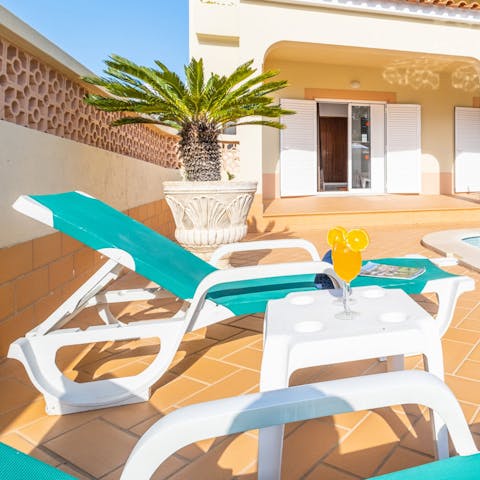 Unwind on the poolside loungers between soaking up the Algarve coastline