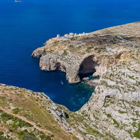 Explore Malta's famous Blue Grotto, a five-minute drive from your villa