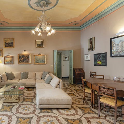 Relax in the grand living area with a glass of Italian wine after a busy day of soaking up the city's history