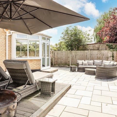 Chill out in your private garden, with sun loungers and seating to relax on
