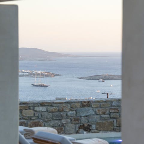 Watch the boats sail into Mykonos
