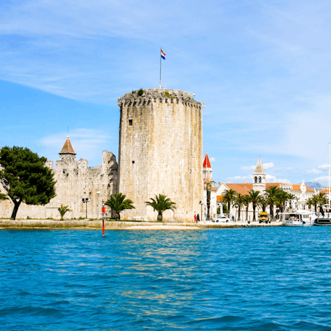 Explore Trogir's Kamerlengo castle, a breezy stroll from your doorstep