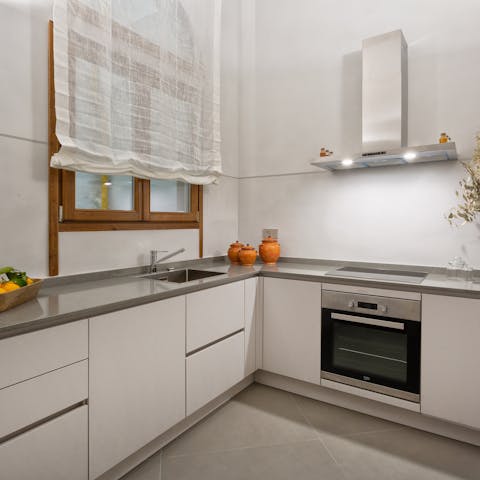 Try your hand at some Tuscan cuisine in the apartment's contemporary kitchen