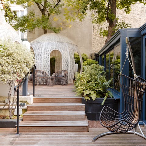 Catch some rays over your holiday read in the leafy communal courtyard