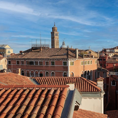 Gaze out at the rooftop view of Venice from the master bedroom