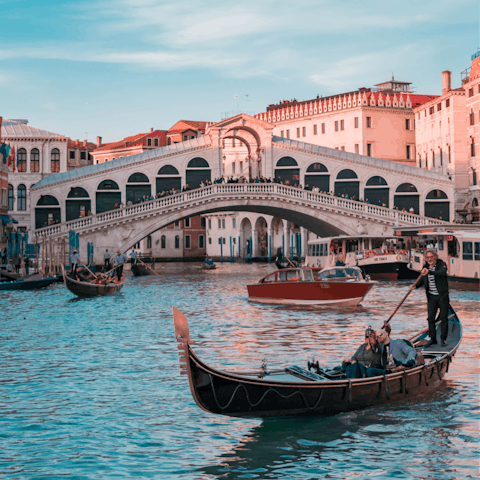 Hail a water taxi and be at the famous Rialto Bridge in two minutes