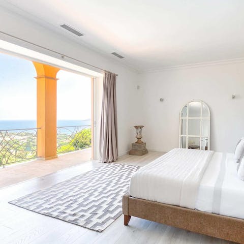 Wake up to panoramic views from your bed