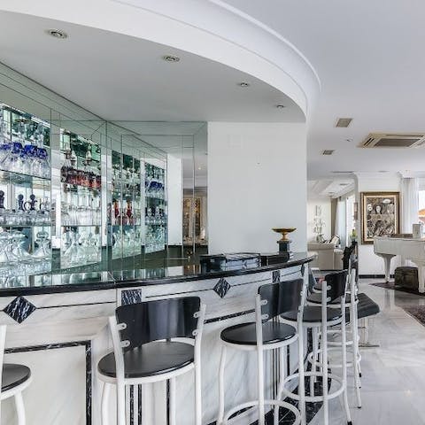 Sip drinks at the cocktail bar