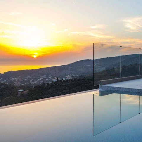 Watch the sunset from the infinity pool
