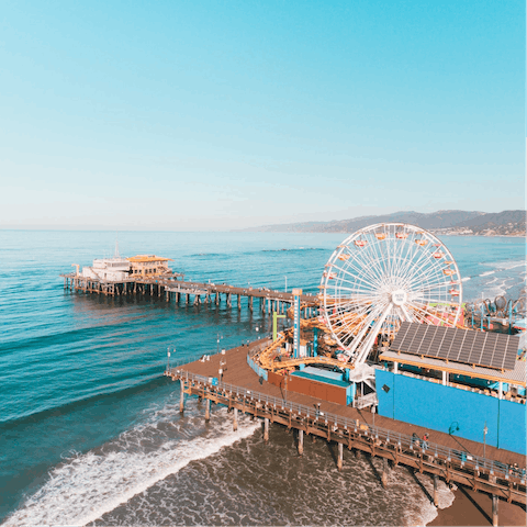 Visit the iconic Santa Monica Pier, a nine-minute drive away