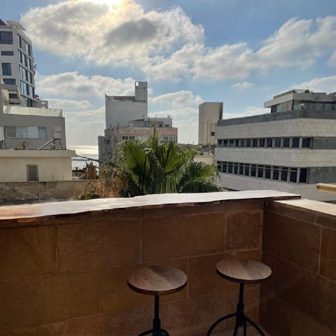 Grab a glimpse of the sea from your perch on the private balcony