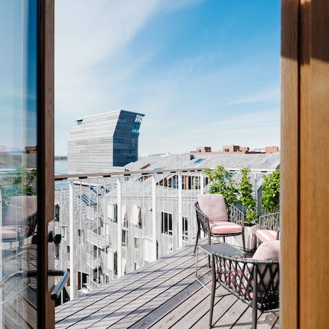 Take in spectacular views over the neighbourhood from your balcony