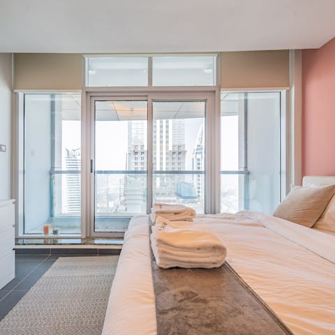 Wake up to giant windows, framing the cityscape from the second balcony