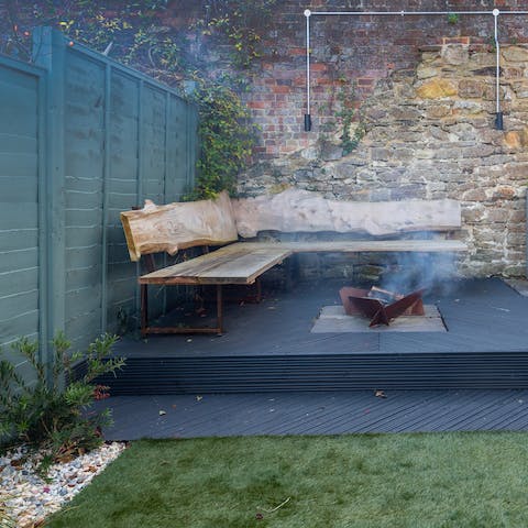 Spend summer nights out in the garden, cooking on the pizza oven and gathering by the fire pit