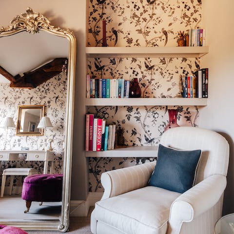 Pick a book off the shelf and settle into an armchair in the dressing room