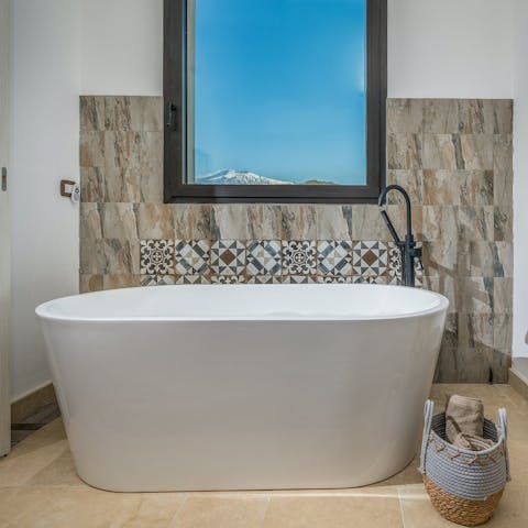 Unwind after sightseeing with a bubble bath in the soaker tub
